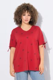 Plus size clothing – Ulla Popken Bow Print Split Sleeve Tee with V-neck, split sleeves, ribbon ties, and A-line fit. 