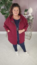 Danny Burgundy Teddy Coat with hood, zip front, and plush teddy texture – warm wool-blend outerwear from Michelle’s Curvy Boutique.