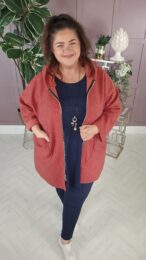 Danny Rust Teddy Coat with hood, zip front, and plush teddy texture – soft wool-blend outerwear from Michelle’s Curvy Boutique.
