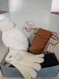 Christmas Gift Box (Cream) with cream bobble hat, cream gloves, navy scarf, tan crossbody purse and patterned wrist strap displayed inside festive gift box.