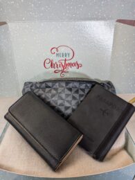 Christmas Gift Box (Travel) with bum bag, tri-fold wallet and passport holder displayed inside festive gift box.