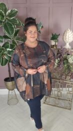 Earth Mosaic Swing Tunic in warm brown and charcoal tones with abstract print, shown on model with relaxed swing fit.