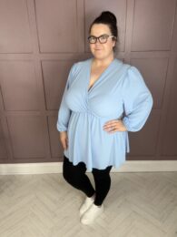 The Amy Top (Baby Blue) faux wrap V-neck balloon sleeve A-line top with pockets in soft baby blue